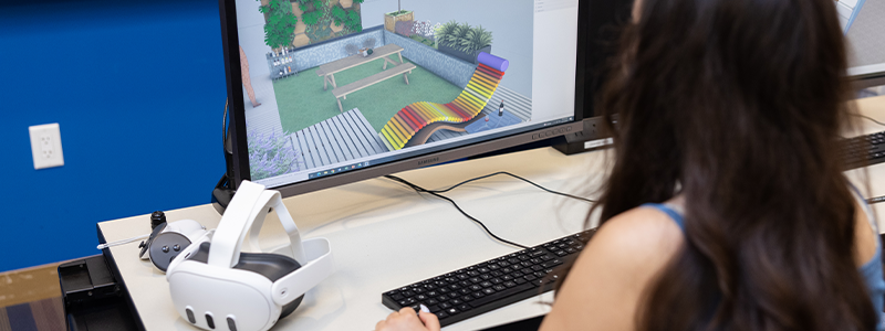 student working on computer in trimble lab at LMU